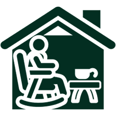 Person relaxing in rocking chair at home.